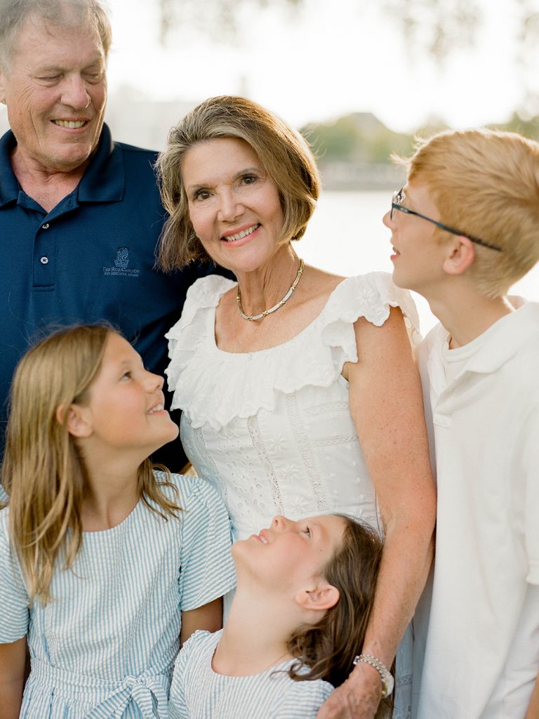 Grandmother surrounded by grandchildren taken during family reunion session in Celebration, Florida. Central Florida Family Photographer, Heidi Vail Photography